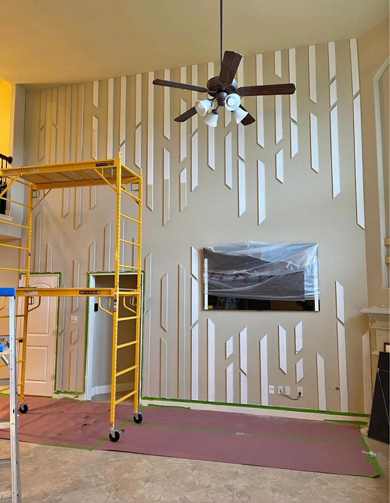 Accent wall installation with scaffold