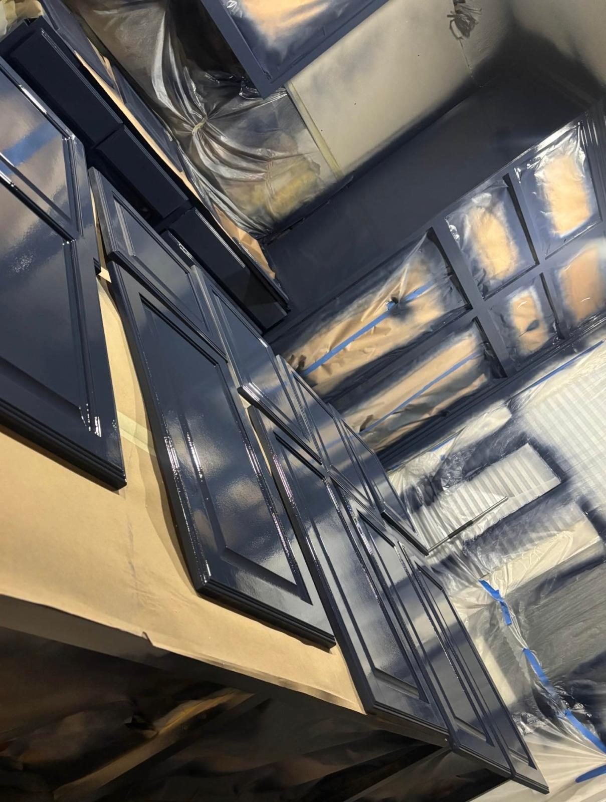 Glossy navy cabinet doors drying